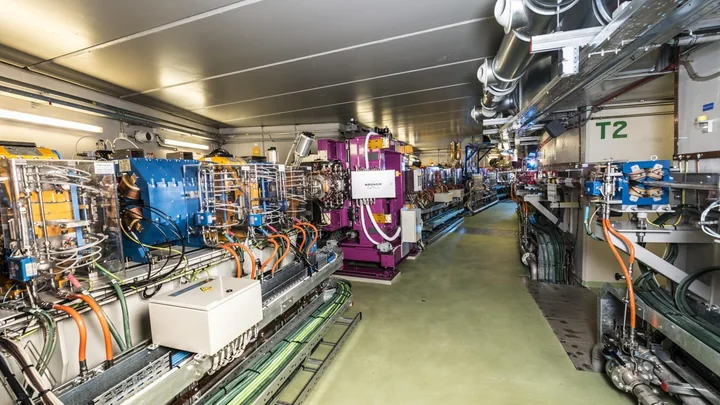 Interior of ALBA Synchrotron with accelerator equipment and auxiliary services.