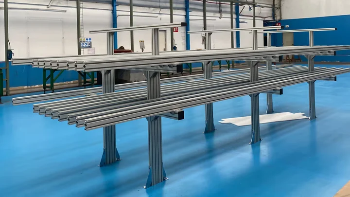 Metal storage structures manufactured for the HL-LHC project, with vertical supports and longitudinal elements.